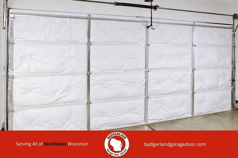 Insulated garage door panels showing weatherproofing work Badgerland Garage Door provides for Wisconsin homeowners in winter.