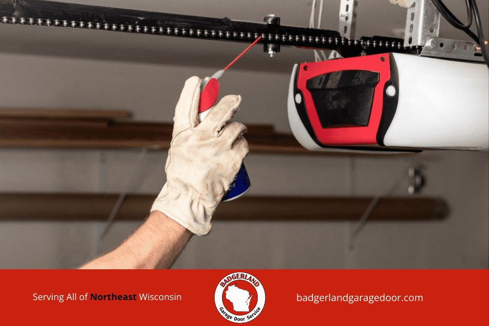 Winter Garage Door Safety_ Protect Your Family and Equipment-2 Homeowner clearing snow from garage door to improve winter safety and protect equipment. Badgerland Garage Door Service.
