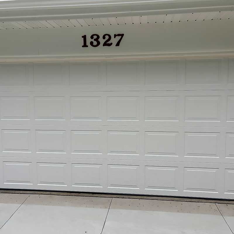 White garage door with the number 1327 above, suitable for garage door repair in Green Bay and Appleton areas.| Badgerland Garage Door Service – Green Bay Garage Door Repair